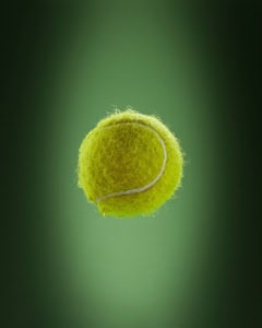 a tennis ball is flying through the air