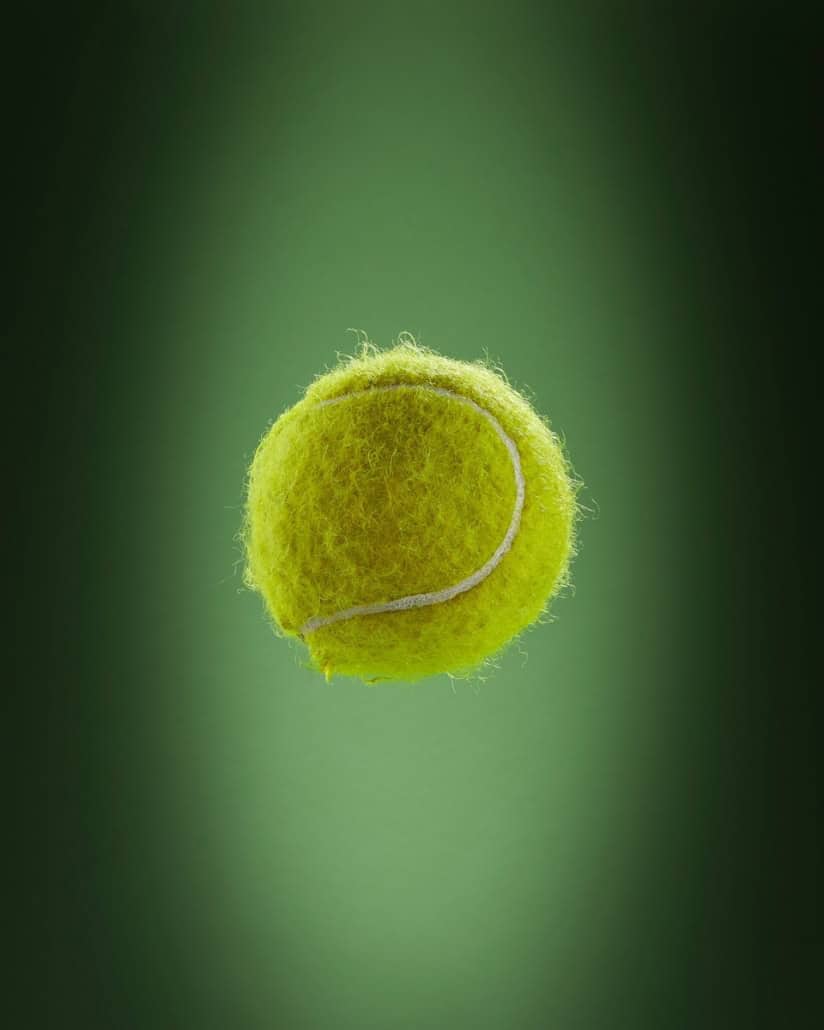 a tennis ball is flying through the air